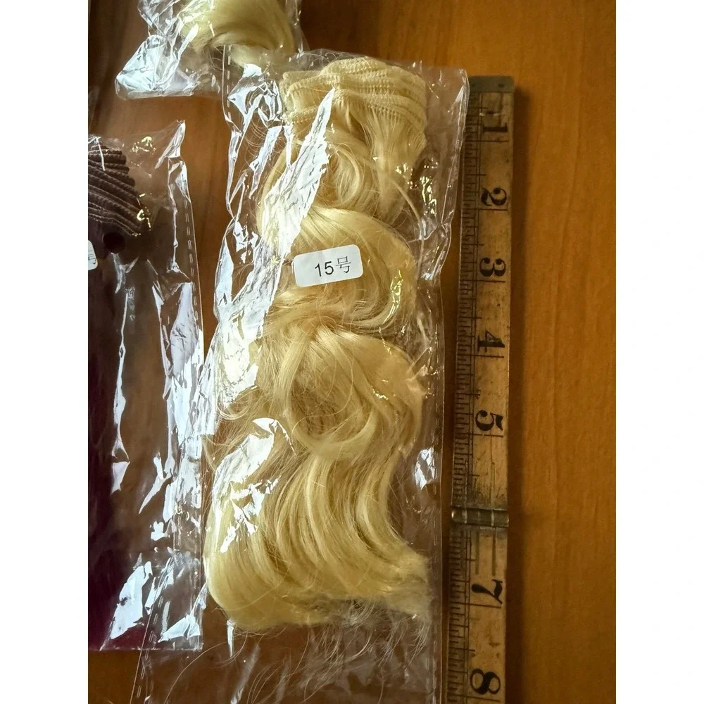 Doll hair wefts. Lot of 13